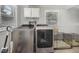 Well-organized laundry room featuring modern appliances and ample storage space; pet crate at 903 S 2Nd St, Smithfield, NC 27577