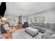 Open living room featuring hardwood floors, large windows, and stylish furniture at 903 S 2Nd St, Smithfield, NC 27577