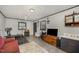 Living area with vintage furnishings, including a plush sofa, unique decor, and ample lighting at 903 S 2Nd St, Smithfield, NC 27577