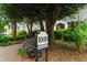 A photo of the property address sign, identifying it as 1000 Brighthurst at 1000 Brighthurst Dr # 104, Raleigh, NC 27605