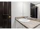 Bathroom with a neutral vanity and a large mirror at 1000 Brighthurst Dr # 104, Raleigh, NC 27605