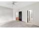 Bedroom featuring neutral walls, carpet, and entry to bathroom; ideal for comfortable living at 1000 Brighthurst Dr # 104, Raleigh, NC 27605