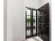 Entryway showing glass paned doors leading to the exterior patio at 1000 Brighthurst Dr # 104, Raleigh, NC 27605
