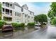Building exterior with ample parking at 1000 Brighthurst Dr # 104, Raleigh, NC 27605