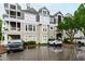 Building exterior with well maintained parking at 1000 Brighthurst Dr # 104, Raleigh, NC 27605