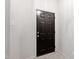 Classic black front door with tile flooring in the entryway at 1000 Brighthurst Dr # 104, Raleigh, NC 27605