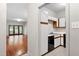 Open kitchen with black appliances and a view of the living area at 1000 Brighthurst Dr # 104, Raleigh, NC 27605