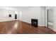 Expansive living room with hardwood floors, fireplace and easy access to the kitchen at 1000 Brighthurst Dr # 104, Raleigh, NC 27605