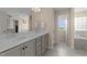 Bathroom features dual sinks, vanity, and a separate tub at 1002 Addington Lake Ln, Knightdale, NC 27545