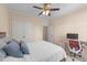 Bedroom featuring carpet, a bed with blue pillows, and a desk for work and study at 1002 Addington Lake Ln, Knightdale, NC 27545