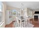 Bright dining area features hardwood floors, large windows, and a cozy atmosphere at 1002 Addington Lake Ln, Knightdale, NC 27545