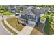 Charming two-story home with a well-manicured lawn, attached garage, and inviting front porch at 1002 Addington Lake Ln, Knightdale, NC 27545