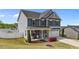 Charming two-story home with blue siding and manicured lawn and landscaping at 1002 Addington Lake Ln, Knightdale, NC 27545