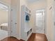 Hallway featuring a white mudroom bench with storage and a view into the bathroom at 1002 Addington Lake Ln, Knightdale, NC 27545