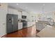 Bright kitchen features stainless steel appliances, granite counters, and hardwood floors at 1002 Addington Lake Ln, Knightdale, NC 27545