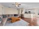 Living room with hardwood floors, neutral walls, and an open concept design to kitchen at 1002 Addington Lake Ln, Knightdale, NC 27545