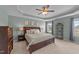 Large main bedroom features tray ceilings, soft carpet, and natural light from the window at 1002 Addington Lake Ln, Knightdale, NC 27545