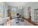 Bright home office with hardwood floors, large window, and ample workspace at 1002 Addington Lake Ln, Knightdale, NC 27545