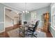 Home office with hardwood floors, natural light, and traditional grandfather clock at 1002 Addington Lake Ln, Knightdale, NC 27545