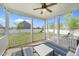 Inviting screened porch overlooking a large backyard with a playset at 1002 Addington Lake Ln, Knightdale, NC 27545