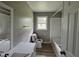 Bathroom with updated vanity, toilet, and shower/tub combination, showcasing recent upgrades at 1064 Abbott Rd, Henderson, NC 27537