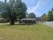 Traditional brick home with a well-manicured front lawn, showcasing curb appeal at 1064 Abbott Rd, Henderson, NC 27537