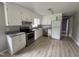 Clean kitchen with white cabinets, granite countertops, and stainless steel appliances at 1064 Abbott Rd, Henderson, NC 27537