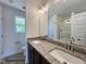 Bathroom with double vanity, granite countertop, and a glass-enclosed shower at 116 Legolas Ct, Middlesex, NC 27557