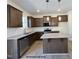 Stylish kitchen with granite counters, stainless appliances, and a convenient center island at 116 Legolas Ct, Middlesex, NC 27557