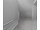 Unfinished attic space with wood framing, insulation, and a door, ready for customization at 12217 Beestone Ln, Raleigh, NC 27614