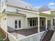 Elevated backyard deck with decorative railings, stairs, and plenty of space for entertaining outdoors at 12217 Beestone Ln, Raleigh, NC 27614