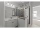 Bathroom with a glass enclosed shower and single sink vanity at 12217 Beestone Ln, Raleigh, NC 27614