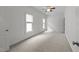 A spacious bedroom with natural light and a ceiling fan at 12217 Beestone Ln, Raleigh, NC 27614