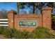 Elegant brick entrance sign for Tournament Players Club, set amidst lush greenery at 12217 Beestone Ln, Raleigh, NC 27614