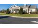 Attractive building exterior with white columns and well-manicured landscaping, enhancing its welcoming appeal at 12217 Beestone Ln, Raleigh, NC 27614