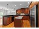 Spacious kitchen with stainless steel appliances, granite countertops, hardwood floors and a center island at 12217 Beestone Ln, Raleigh, NC 27614
