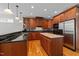 Well-appointed kitchen with granite countertops, stainless appliances, hardwood floors, and an island at 12217 Beestone Ln, Raleigh, NC 27614
