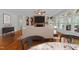 Stylish living room with a cozy fireplace, built-in bookshelves, and large windows for natural light at 12217 Beestone Ln, Raleigh, NC 27614