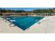 Beautiful, expansive swimming pool with diving blocks and a dedicated no-diving area, offering a refreshing and safe recreational space at 12217 Beestone Ln, Raleigh, NC 27614