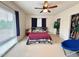 Inviting bedroom with neutral carpet, large window, and closet space at 1230 Capability Dr # 106, Raleigh, NC 27606