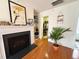 Elegant living room with a fireplace, stylish decor, and easy access to a walk-in closet at 1230 Capability Dr # 106, Raleigh, NC 27606