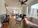 Open-concept living room boasts hardwood floors, large windows, and plenty of natural light at 1230 Capability Dr # 106, Raleigh, NC 27606