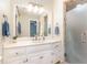 Bathroom vanity featuring a marble countertop, updated fixtures, and neutral decor at 12709 Timberlane Ct, Raleigh, NC 27613