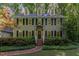 Charming two-story home with black shutters, dormer windows, and a landscaped front yard at 12709 Timberlane Ct, Raleigh, NC 27613