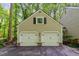 Spacious two-car garage with classic doors, offering ample parking and storage space at 12709 Timberlane Ct, Raleigh, NC 27613