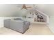Inviting living room with vaulted ceilings, gray sofa, and fun recreational area at 12709 Timberlane Ct, Raleigh, NC 27613