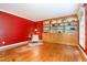 Comfortable room showcasing built-in wooden bookshelves and vibrant red walls at 12709 Timberlane Ct, Raleigh, NC 27613