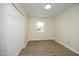 An empty bedroom with laminate flooring and closet at 1422 Duggins Dr, Burlington, NC 27217