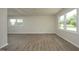 Spacious room with new laminate flooring, large windows offering ample natural light, and neutral colored walls at 1422 Duggins Dr, Burlington, NC 27217