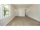 Bright, open living space with new laminate flooring and neutral walls, creating a fresh and modern feel at 1422 Duggins Dr, Burlington, NC 27217
